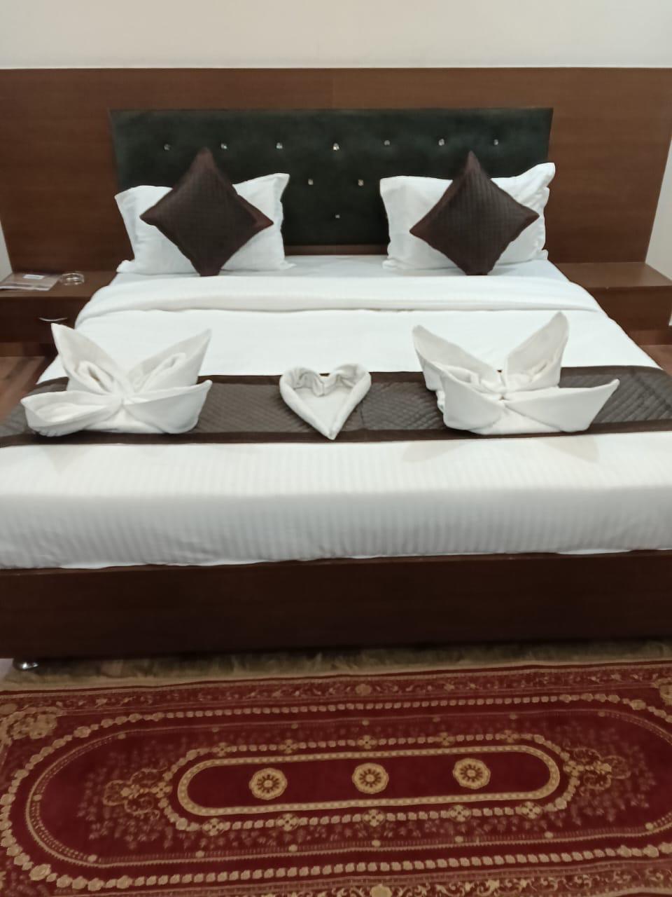 Luxury resort pool with palm trees at sunset